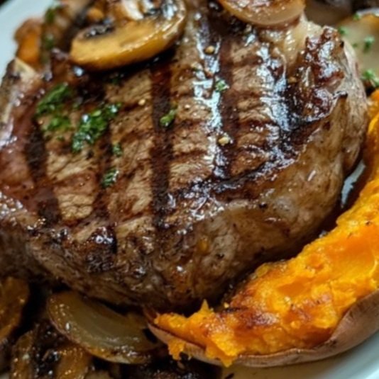 Grilled Ribeye Steak with Baked Sweet Potato and Roasted Mushrooms & Onions: A Hearty, Flavor-Packed Meal