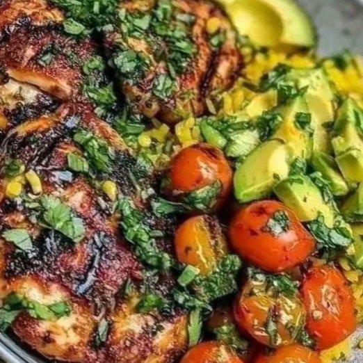 Mediterranean Grilled Chicken Thighs with Avocado Tomato Salad and Saffron Rice