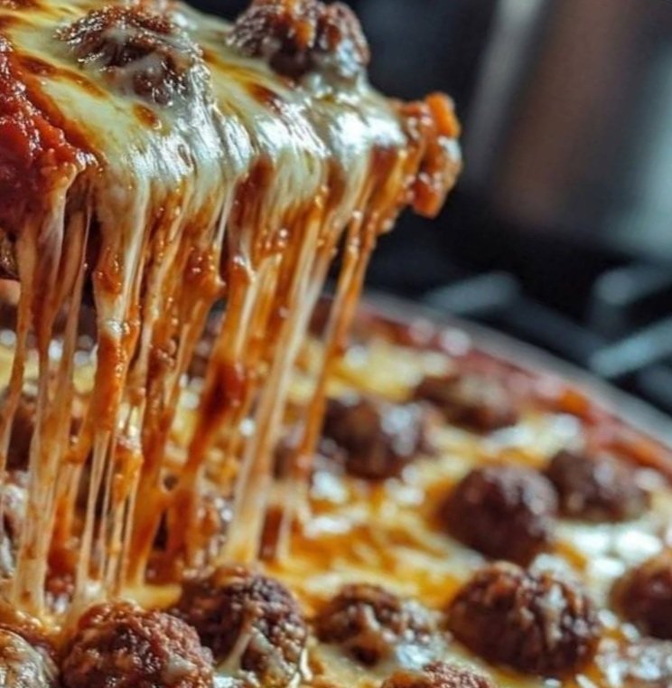 Ultimate Deep Dish Pizza with Cheesy Goodness and Savory Meatballs