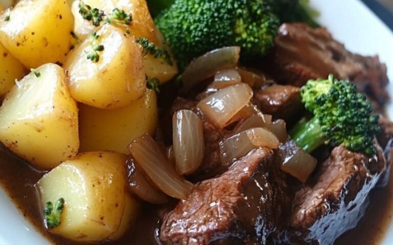 Hearty Braised Beef with Silky Onion Sauce, Rustic Potatoes, and Vibrant Broccoli